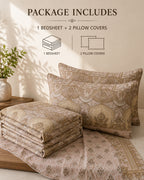A bedding set displayed on a bed in a styled room scene, with two patterned pillowcases and a matching folded bedsheet. Text at the top reads 'PACKAGE INCLUDES 1 BEDSHEET + 2 PILLOW COVERS' with simple line drawings indicating the included pieces.