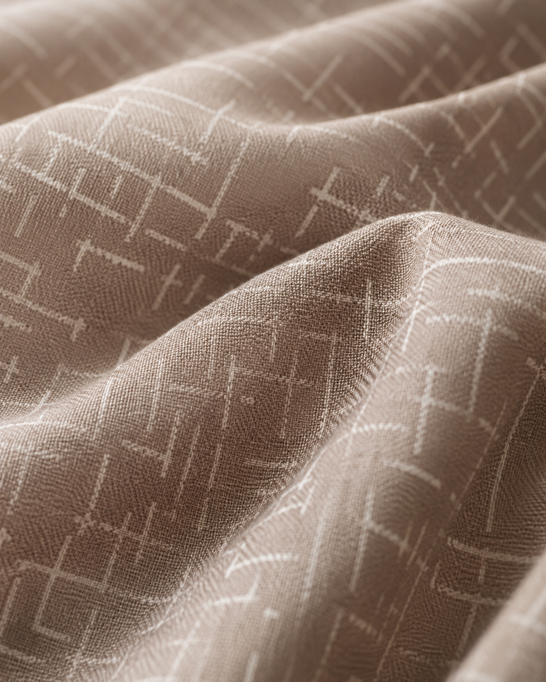 A close-up of draped fabric in a warm taupe-beige color with a subtle white geometric lattice pattern.