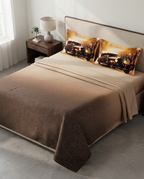 A styled bed in a modern bedroom setting featuring a brown gradient textured blanket and two matching pillowcases printed with a vintage car scene.