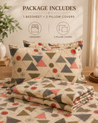 A bedding set displayed on a bed in a styled bedroom scene, including a patterned bedsheet and two matching pillow covers. The fabric has a cream base with geometric triangles and floral motifs in muted red, olive green, and charcoal gray.